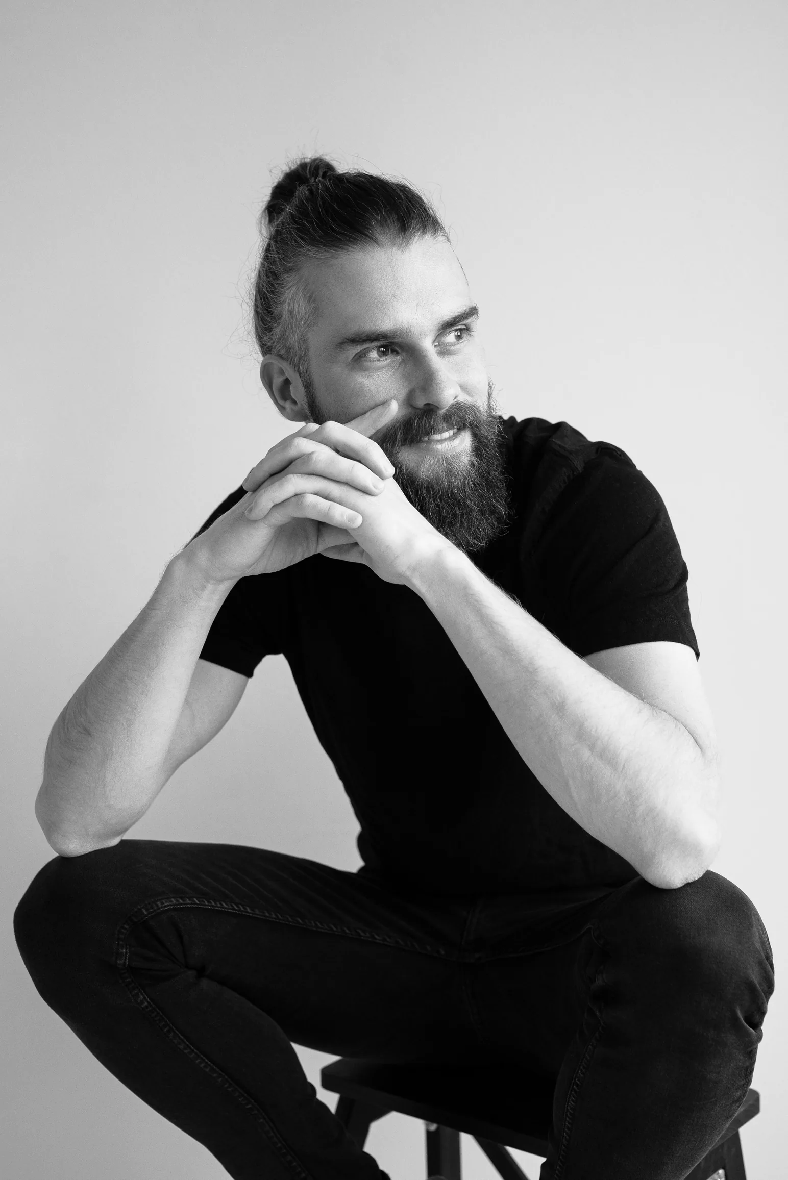 Peter Rod, seated, in black and white.